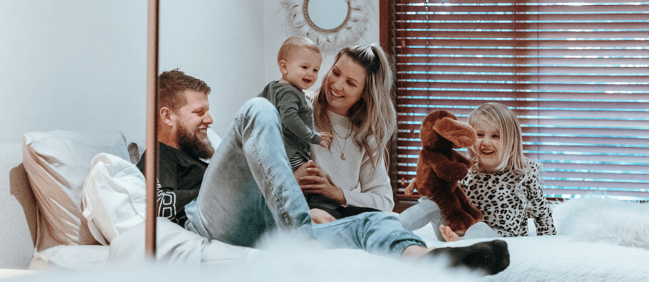 family on bed